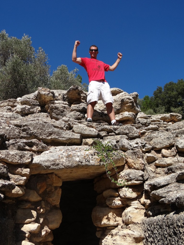 Me on top of an ancient Mycenaean burial site in the Archanos Cemetery of Crete