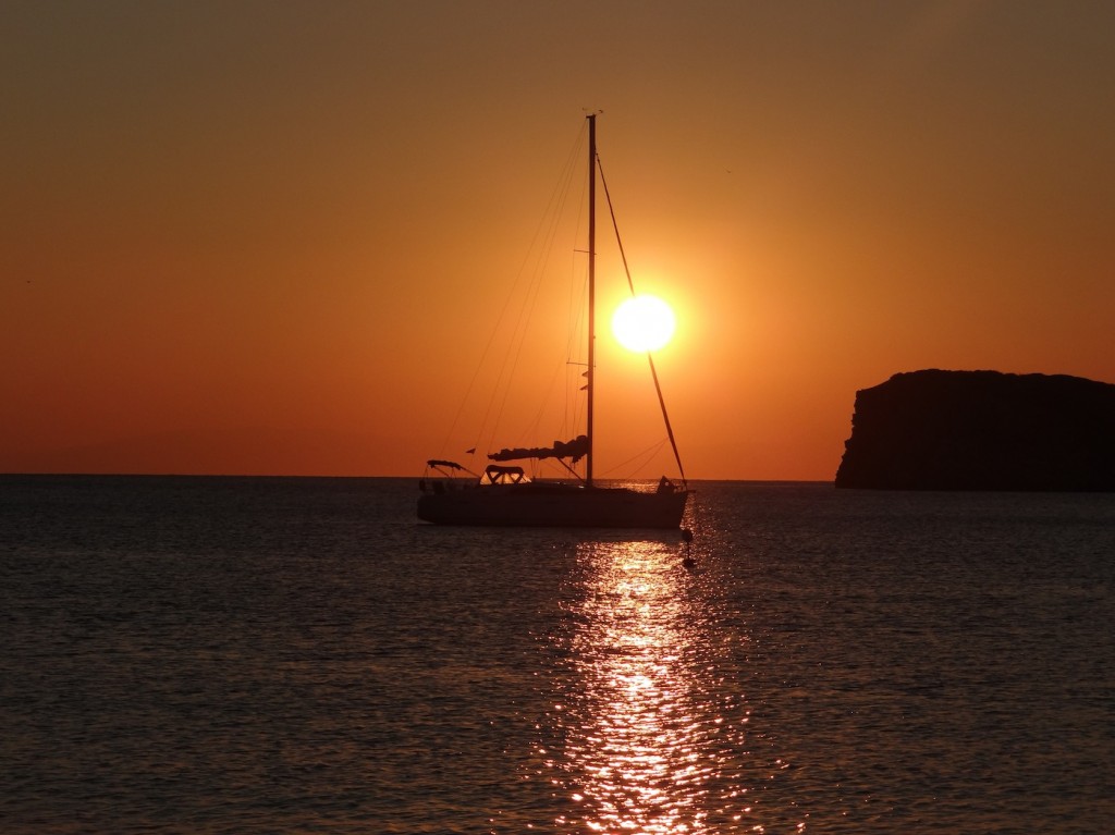 Greek sailboat with the sunset over the beach at Sounion.
