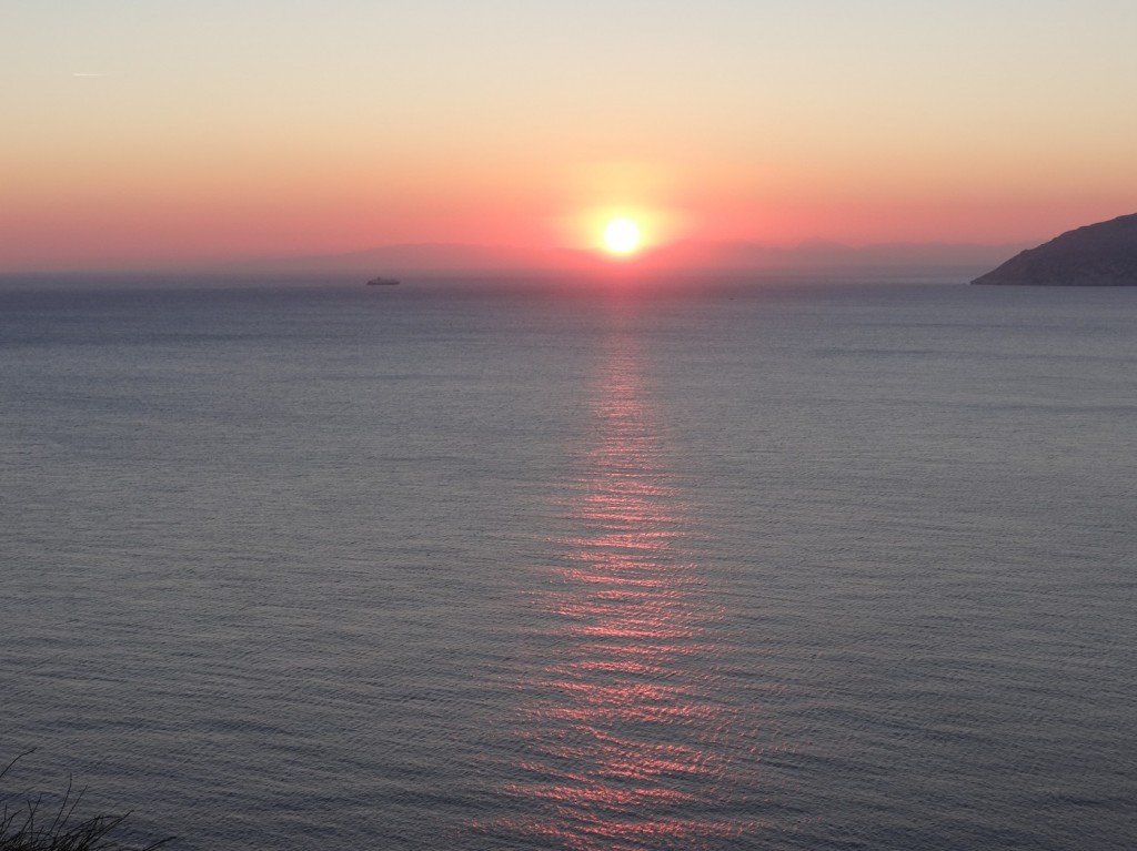 The most beautiful sunset I have ever seen: the deep red Aegean sun literally melting into the soft blue water. I sight I won't forget.