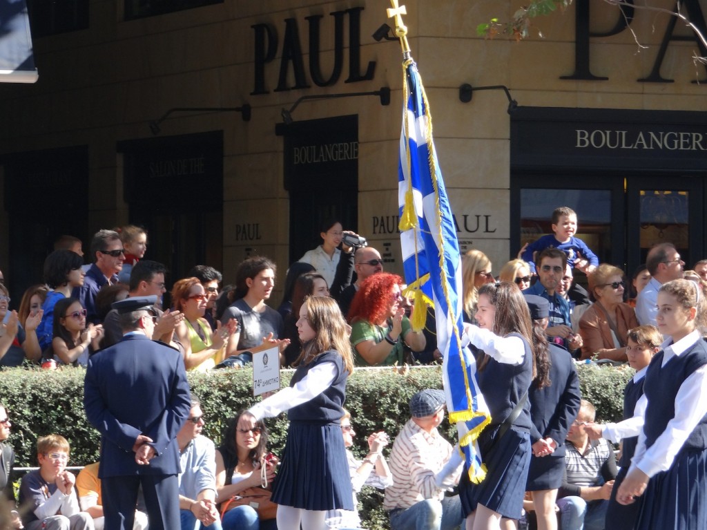 The Oxi Day Parade! It consisted of the boys and girls from the Athens' elementary and middle schools, marching and holding flags followed by bands playing Greek tunes. 