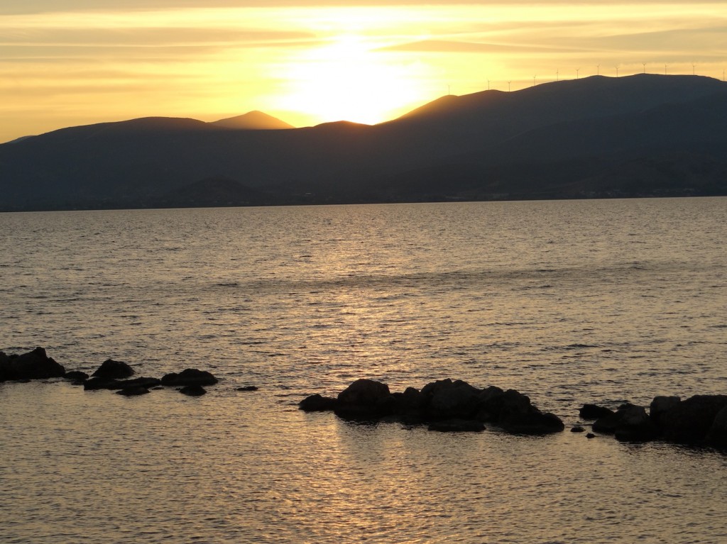 Yellow pastel sunset over coast of Nauplio. 