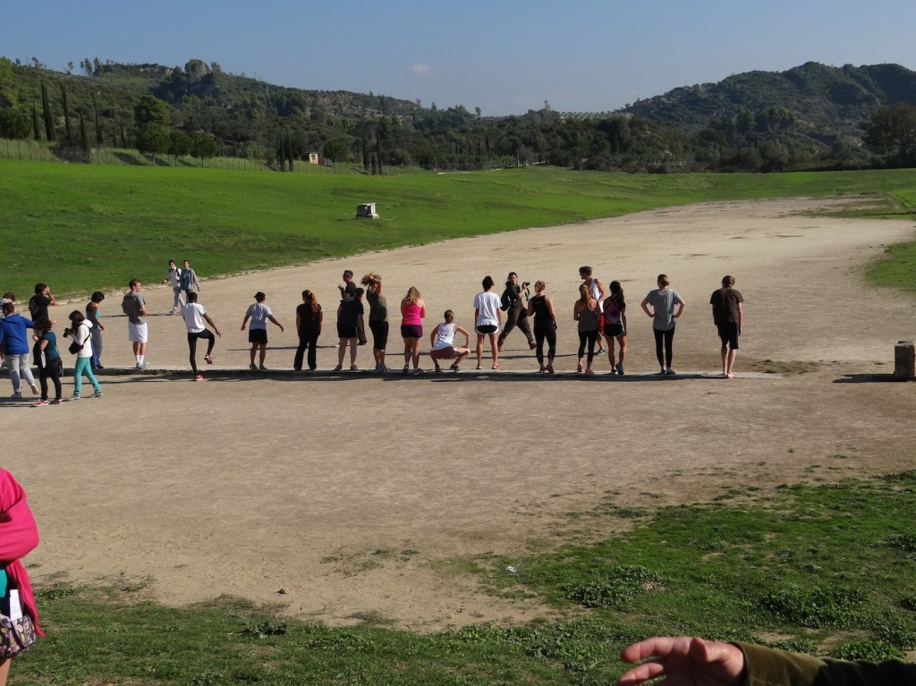 Remains of the ancient track at Olympia, along with CYA students about to run on it! 