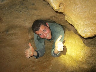 Me squirming through the underground caves of Budapest.
