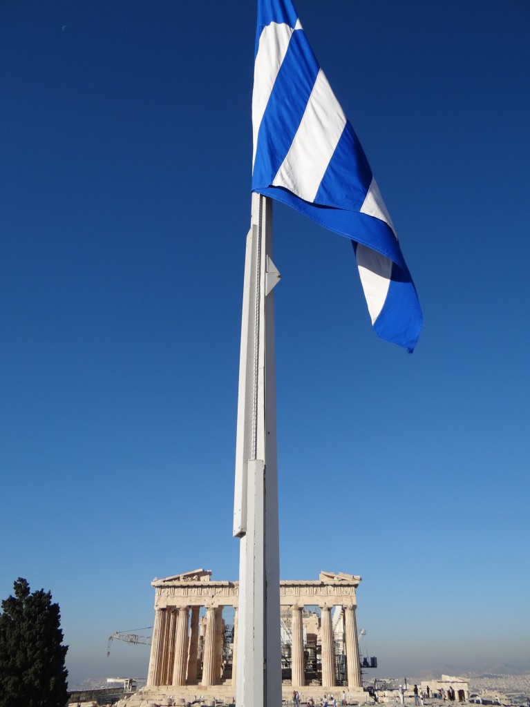 Greek pride: A beautiful blue flag against the eternal marble of the Parthenon.
